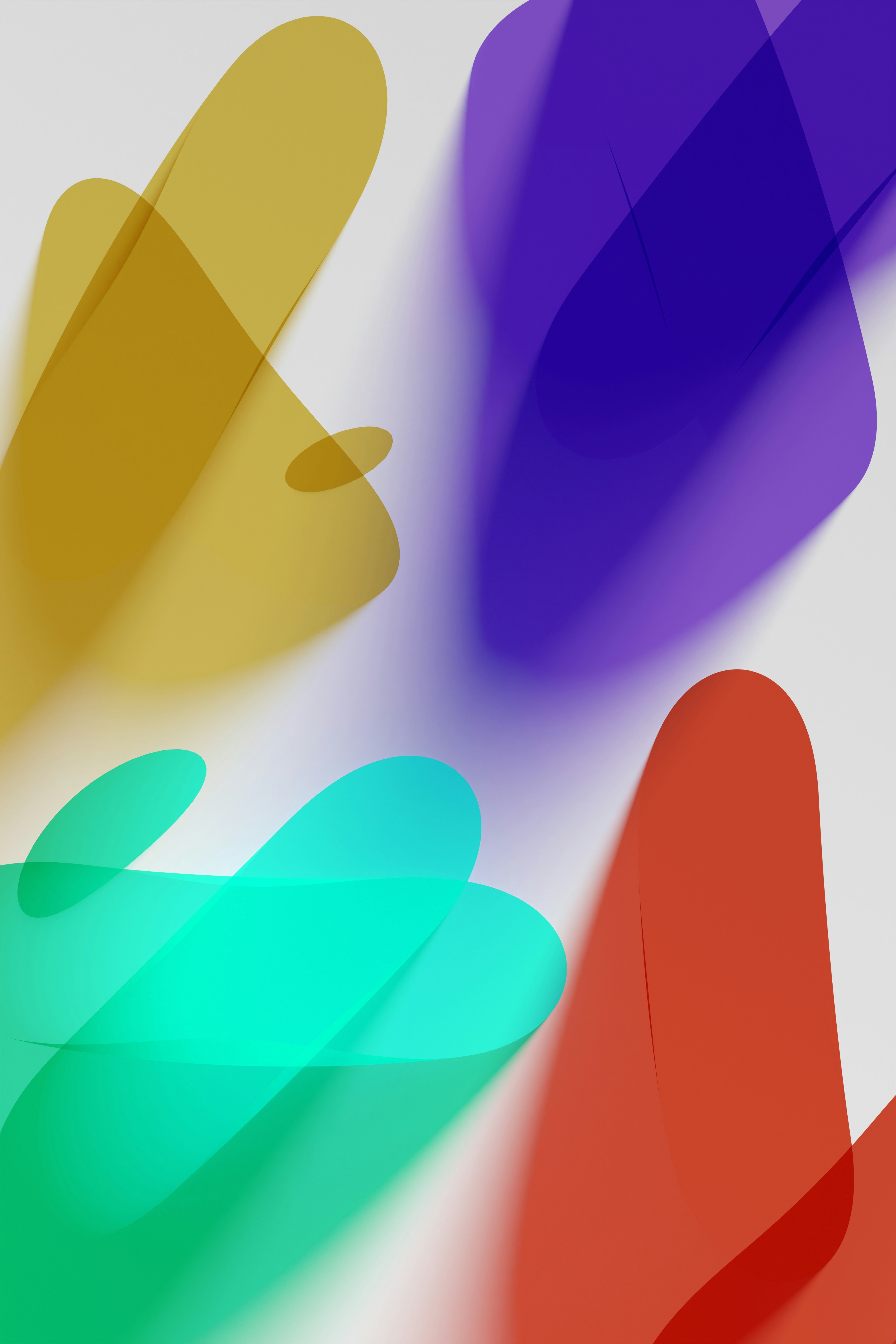 a group of different colored shapes on a white surface